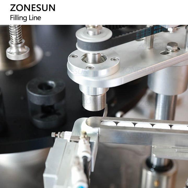 cap feeding structure of essential oils packaging machine