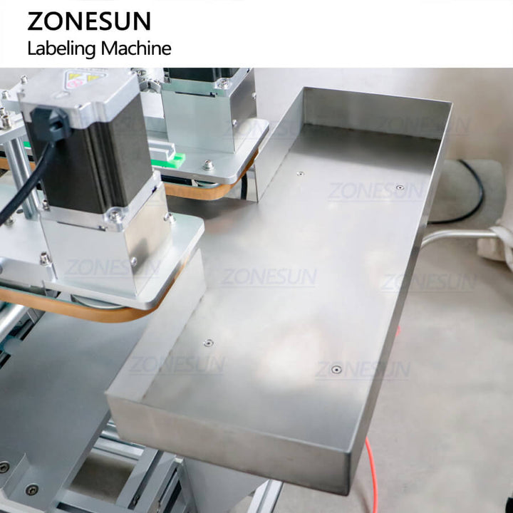 outfeed tray of automatic metal can front size & bottom labeling machine for face cream