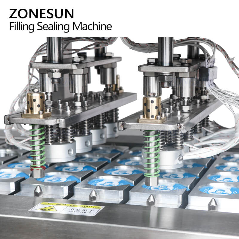 sealing system of dairy cup filling machine