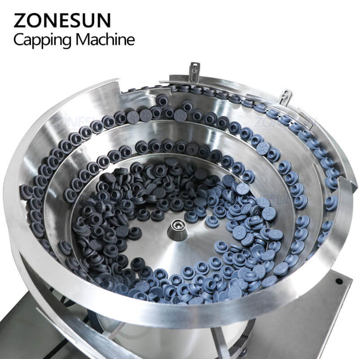 vibratory feeding system of cap pressing machine